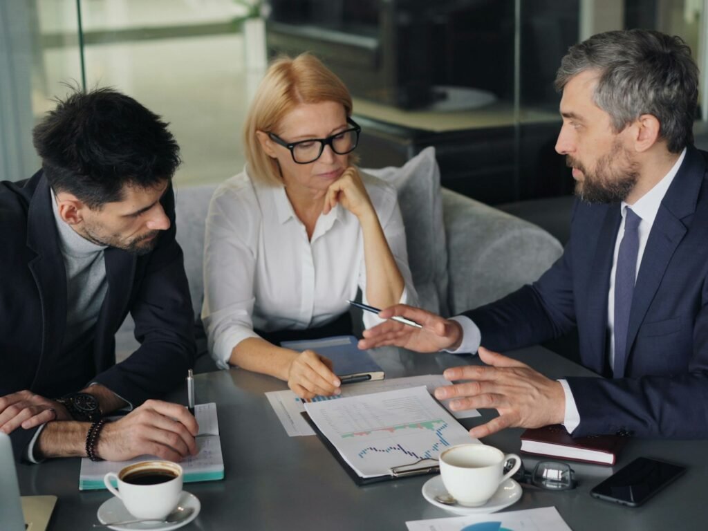 Professionals reviewing documents at a table